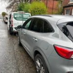 Mobile EV Charging van powering an electric car on a UK street during roadside service