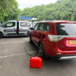 Drain Doctor Manchester service van assisting a stranded vehicle at the roadside